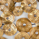 Escultura de metal dorado Lesbos